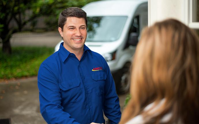 technician greeting customer at the door