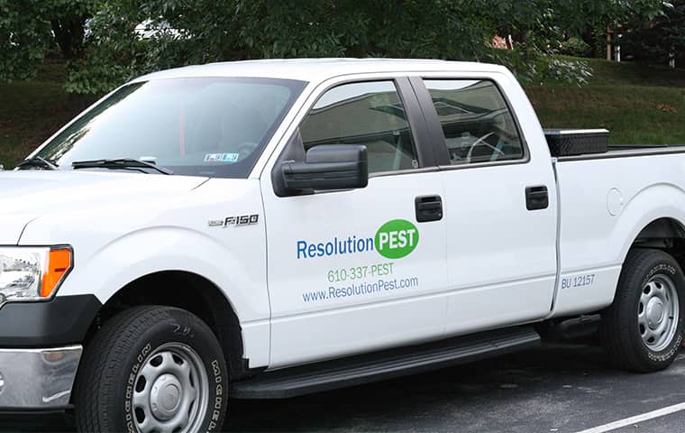 We Are Proud To Serve The Philadelphia Metro Area a resolution pest company vehicle parked outside of a home in wayne pennsylvania