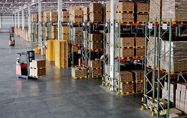 a forklift in a large warehouse