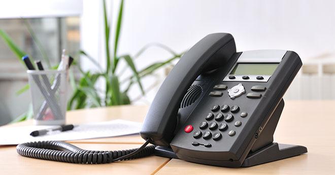 an office phone on a desk