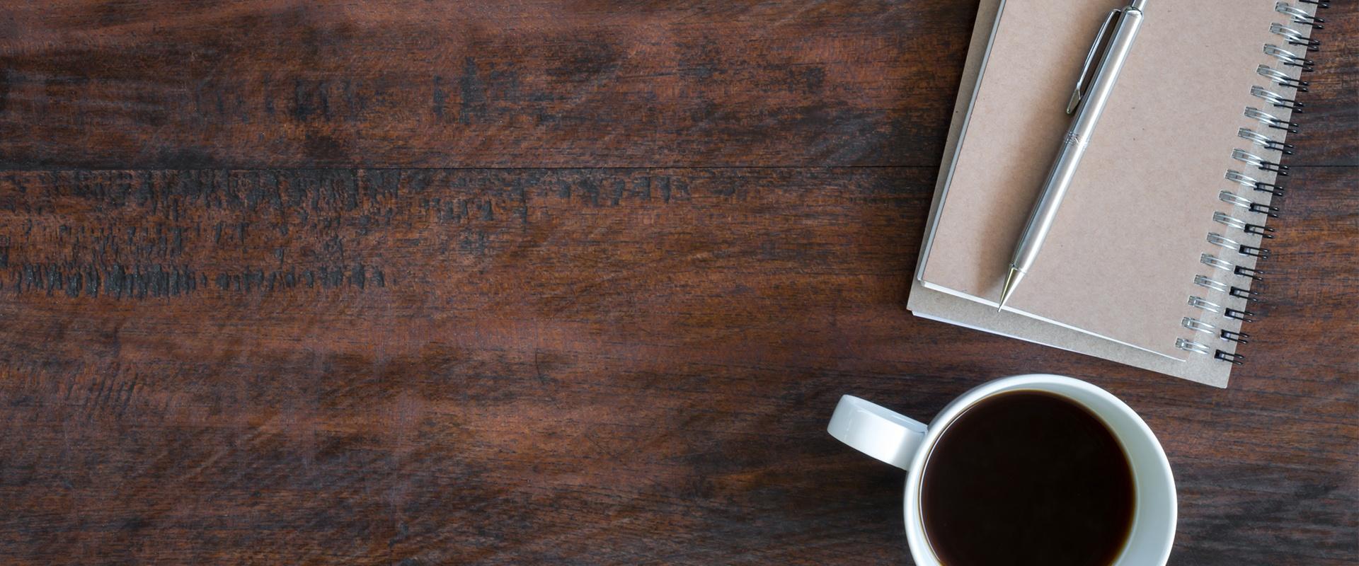 coffee cup on a wooden desk