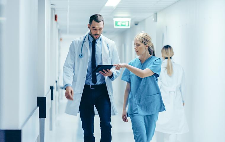 doctor and nurse in a hallway