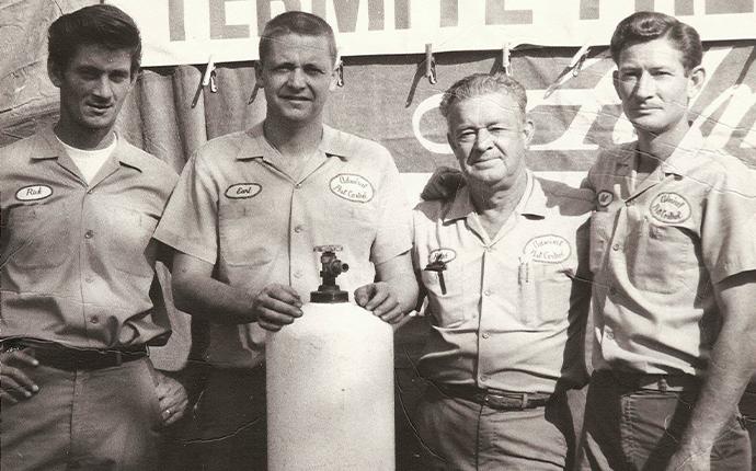 an old picture of admiral pest control technicians