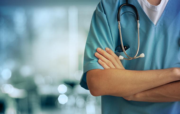 a doctor with arms crossed