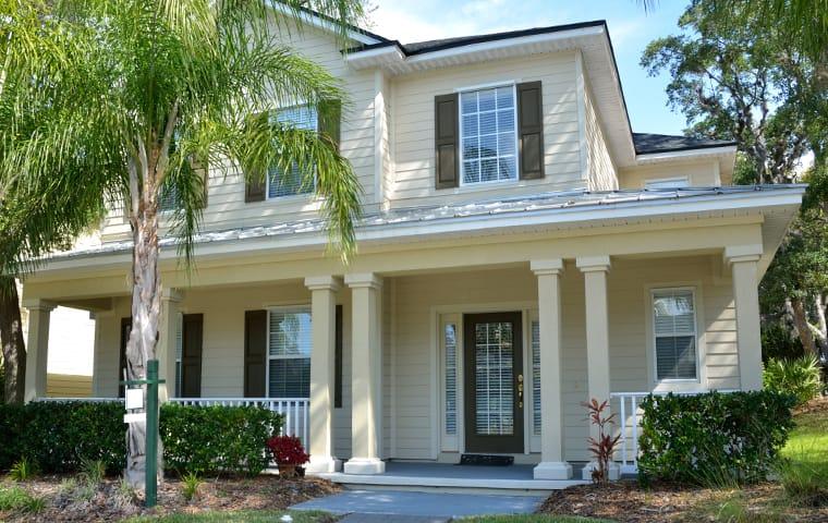 a large home with palm trees in winter springs florida