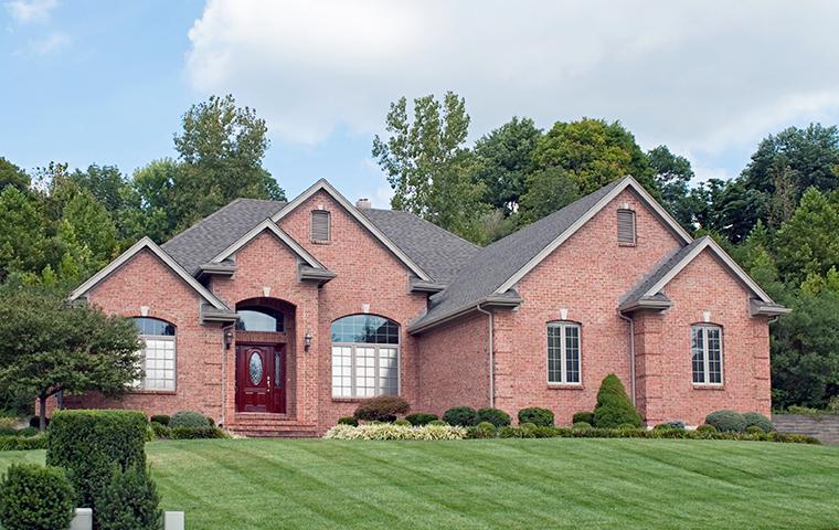 street view of large brick home