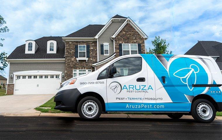 a pest control service vehicle parked outside of a home in charleston south carolina