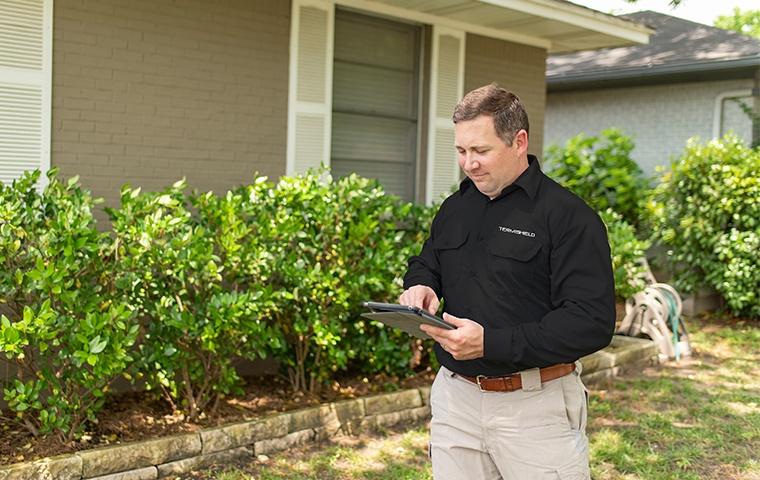 a home inspector performing a wood destroying insect inspection on a real estate property in mishawaka indiana