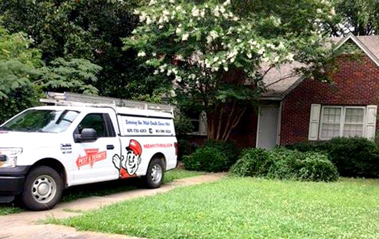 Mid-South Offers A Variety Of Pest Control Plans a mid south pest and termite company vehicle parked outside of a home in memphis tennessee