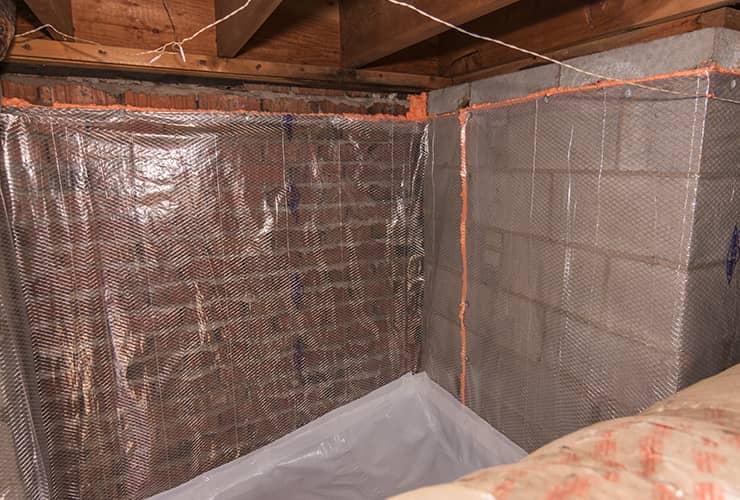 Learn How to Control Moisture To Minimize Pests plastic wrapped crawl space prepared for moisture control and pest control