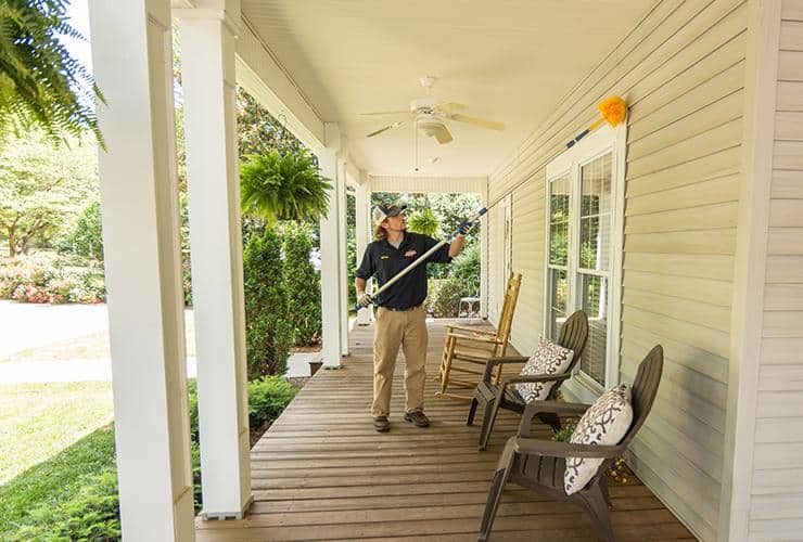 Exterior Home Pest Control pest control tech treating exterior