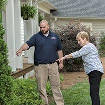 A Service Professional Will Show You How To Deter Mosquitoes a greenville pest professional showing homeowner conditions that attract mosquitoes