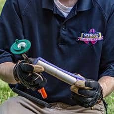 Continuous Monitoring Ensures That Termites Don't Take Over greenville pest control tech inspection bait station for termites