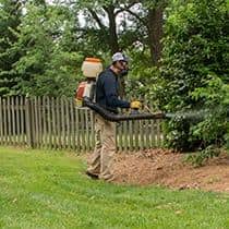 A Service Professional Will Treat Areas Where Mosquitoes Rest & Breed pest control technician conducting mosquito control service