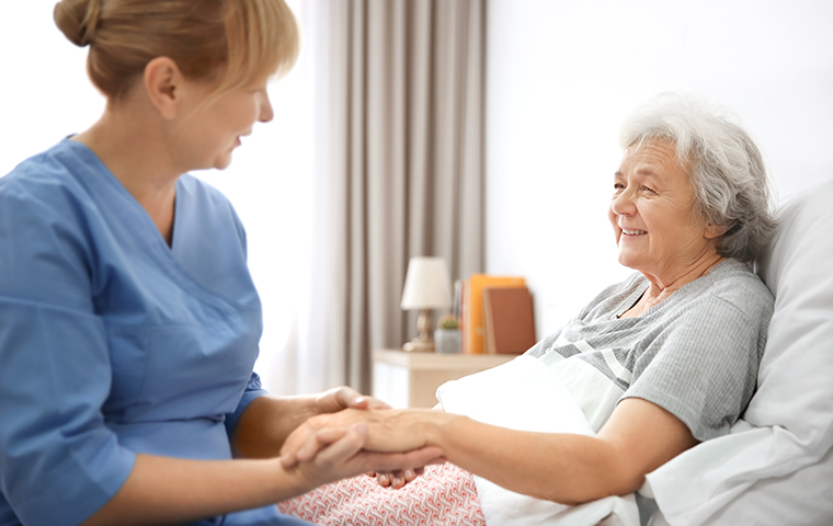 a nurse and an elderly woman in a nursing home in canton