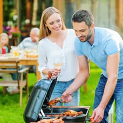 family enjoying barbecue