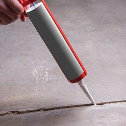 a resident sealing cracks for pest prevention