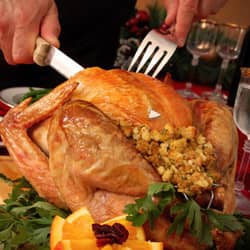 springfield man cutting turkey for thanksgiving