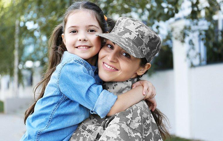military woman and her daughter