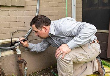 man inspecting home