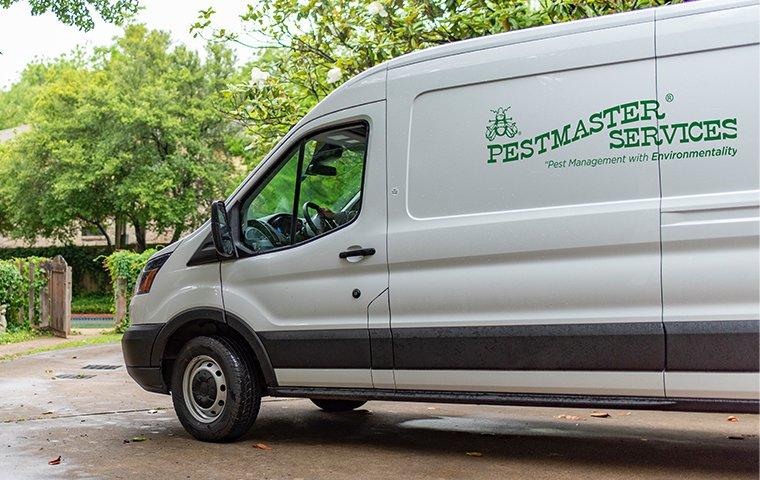 pestmaster services vehicle in driveway