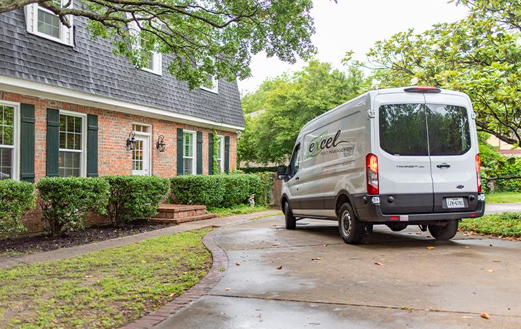 van with logo in driveway