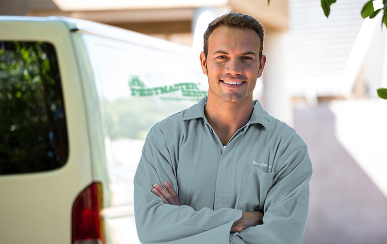 a friendly pestmaster services technician
