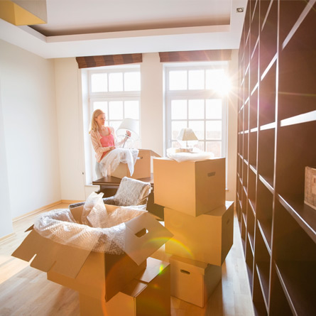 woman packing boxes to move