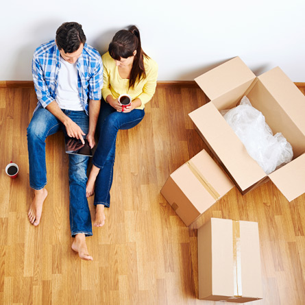 couple packing moving boxes