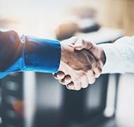 moyer professional shaking hands with new acquistion