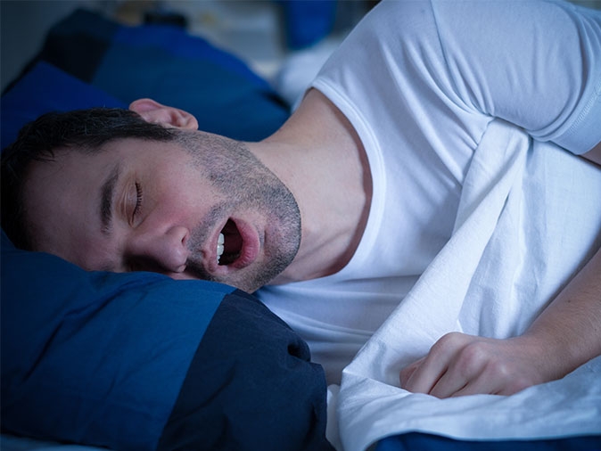 snoring is a symptom of sleep apnea