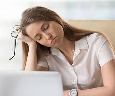 lady at risk for sleep apnea falling asleep at work
