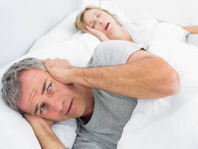 wife's sleep apnea-induced snoring keep husband awake