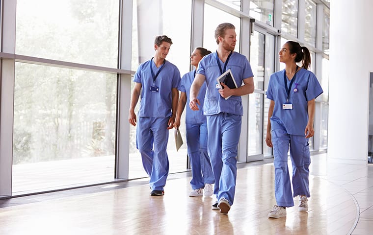 four staff members walking in a hospital hallway in columbia south carolina