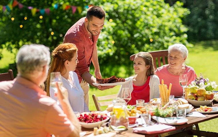 a family eating outside