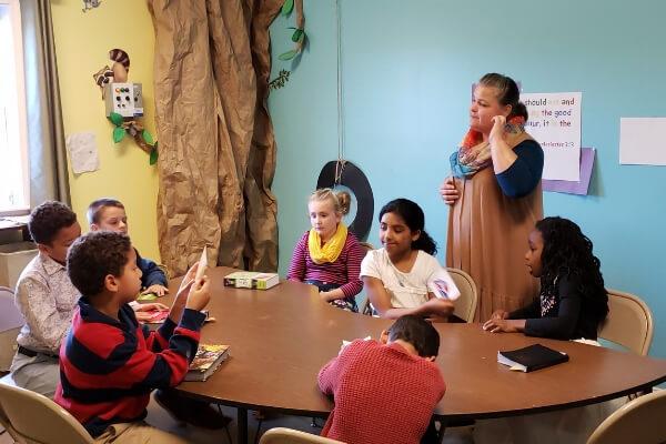 Sunday School person teaching children in sunday school