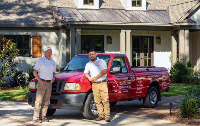 technicians in front of van