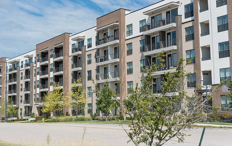 a row of apartment buildings serviced by addison pest control of texas in the dallas metropolitan area