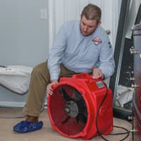 Bill Clark Of Thomas Prepares A Home For Bed Bug Heat Treatment Thomas pest control technician setting up bed bug heat treatment