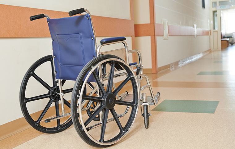 a wheel chair in the hall way of a hospital