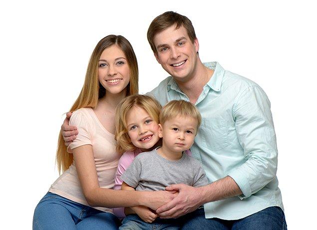 A smiling family of four in Elizabeth City, NC