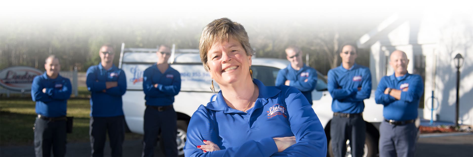 the team of lindsey pest professionals standing outside of their office in florida