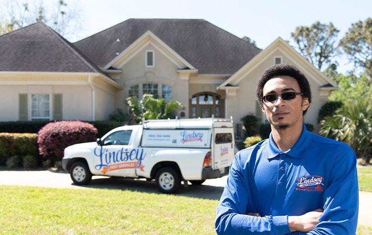 a technician standing outside of a bryceville florida home