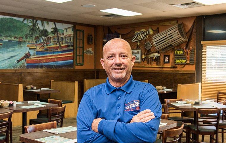 a lindsey technician inspecting for pests in a callahan florida restaurant