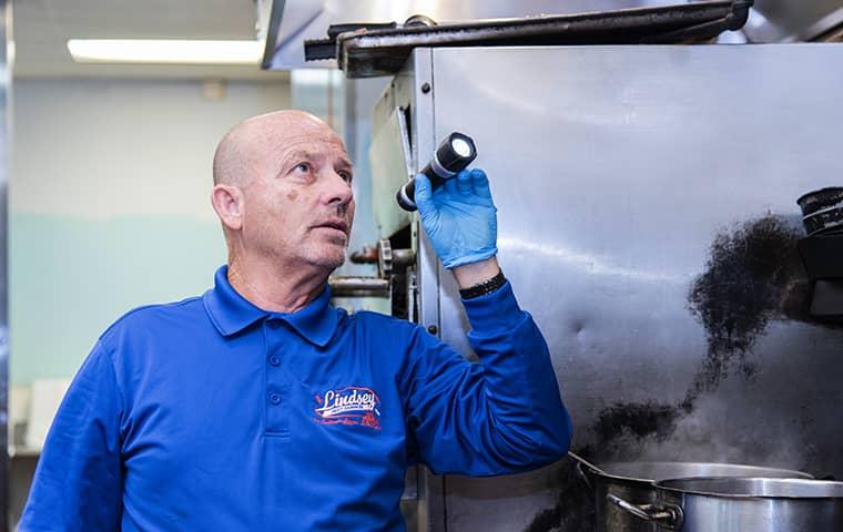 a technician inspecting a fleming island facility