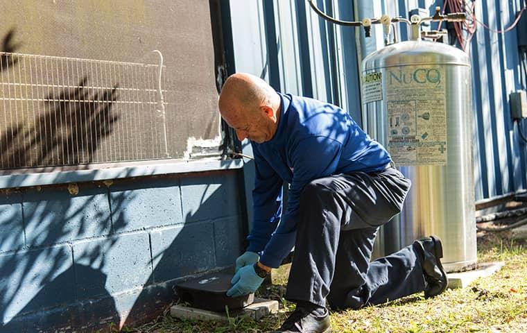 a technician treating a julington creek florida facility