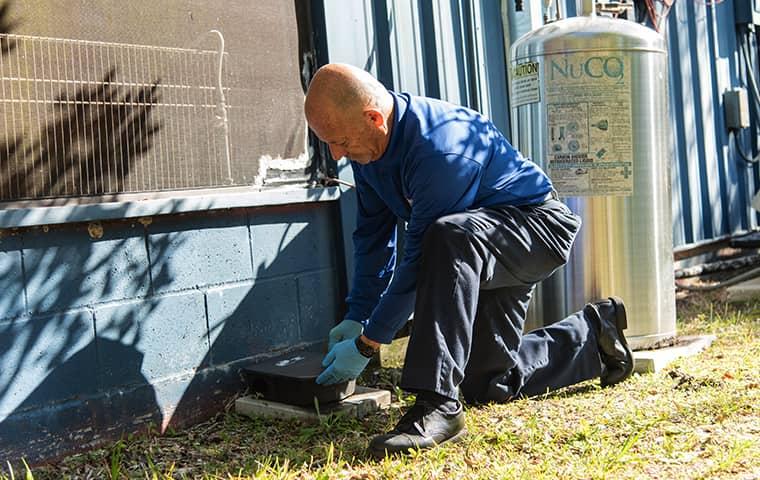 a technician treating a palm valley florida facility