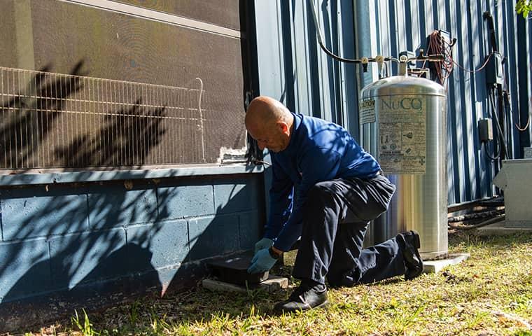 a technician treating a san marco florida facility