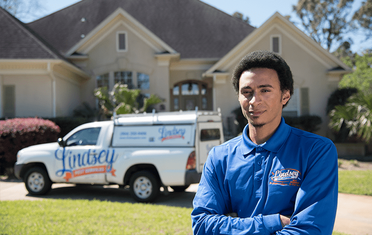 a technician standing outside of a jacksonville florida home