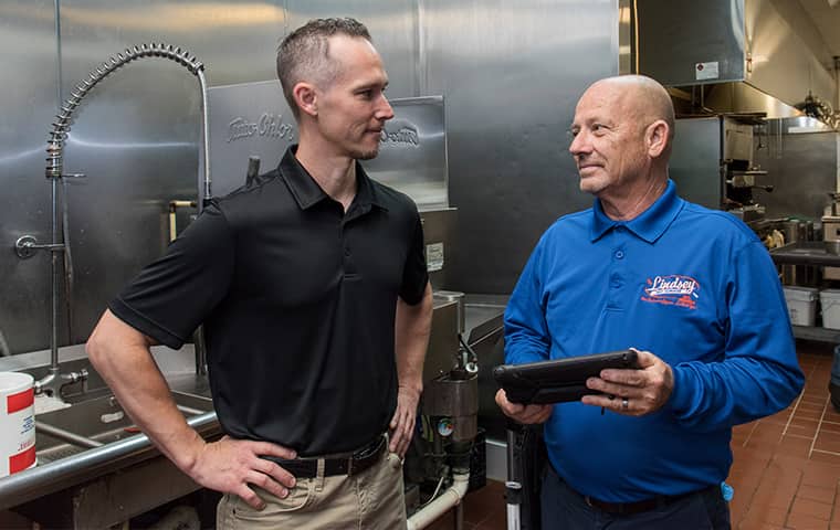 a lindsey technician meeting with a commercial business owner in yulee florida